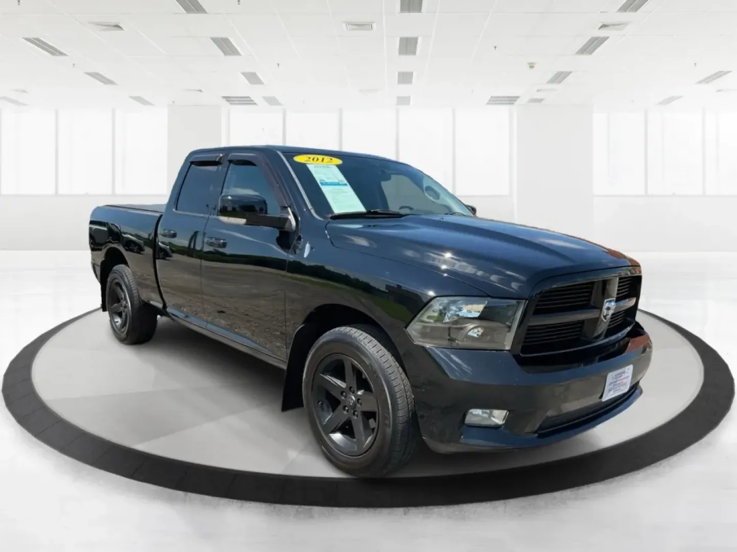 2012 Black Ram 1500 Sport Quad Cab 4WD (1C6RD7HT2CS) with an 5.7L V8 OHV 16V engine, 6-Speed Automatic transmission, located at 1230 East Main St, Xenia, OH, 45385, (937) 908-9800, 39.688026, -83.910172 - **Adventure Awaits: Discover the 2012 Ram 1500 Sport Quad Cab 4WD at Advantage Car and Credit in Xenia, OH!**<br /> <br /> Are you ready to elevate your lifestyle with a vehicle that can handle your adventurous spirit? Whether you're tackling weekend getaways, handling family trips, or just commutin - Photo#0