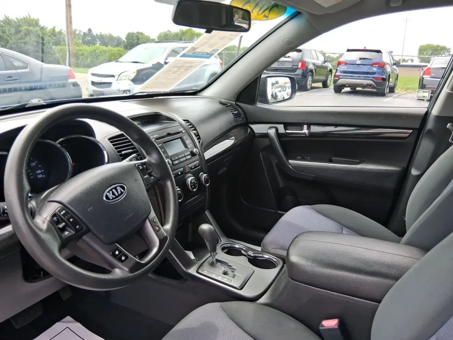 2013 Baltic Blue Kia Sorento LX 4WD (5XYKTCA69DG) with an 2.4L L4 DOHC 16V engine, 6-Speed Automatic transmission, located at 1184 Kauffman Ave, Fairborn, OH, 45324, (937) 908-9800, 39.807072, -84.030914 - **Adventure Awaits with the 2013 Kia Sorento LX 4WD at Advantage Car and Credit - Fairborn!**<br /> <br /> Are you ready to elevate your family adventures or make your daily commute incredibly comfortable? Look no further than this spacious and versatile 2013 Kia Sorento LX 4WD, perfect for growing - Photo#9