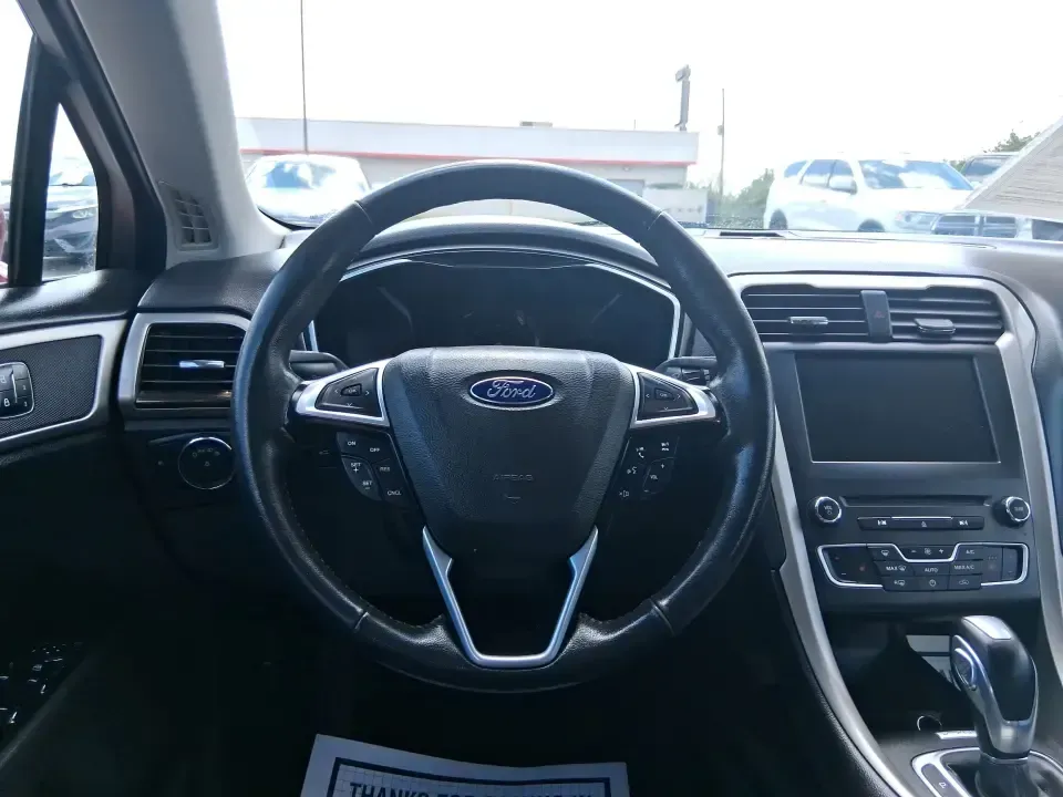 2016 Ford Fusion SE (3FA6P0HD7GR) with an 1.5L L4 DOHC 16V engine, 6-Speed Automatic transmission, located at 1099 N County Rd 25A, Troy, OH, 45373, (937) 908-9800, 40.057079, -84.212883 - Experience the perfect blend of style, comfort, and reliability with this 2016 Ford Fusion SE, available now at Advantage Car and Credit in Fairborn, OH. Whether you're a commuter navigating the busy streets of downtown Fairborn or a growing family looking for a dependable vehicle for your weekend a - Photo#16