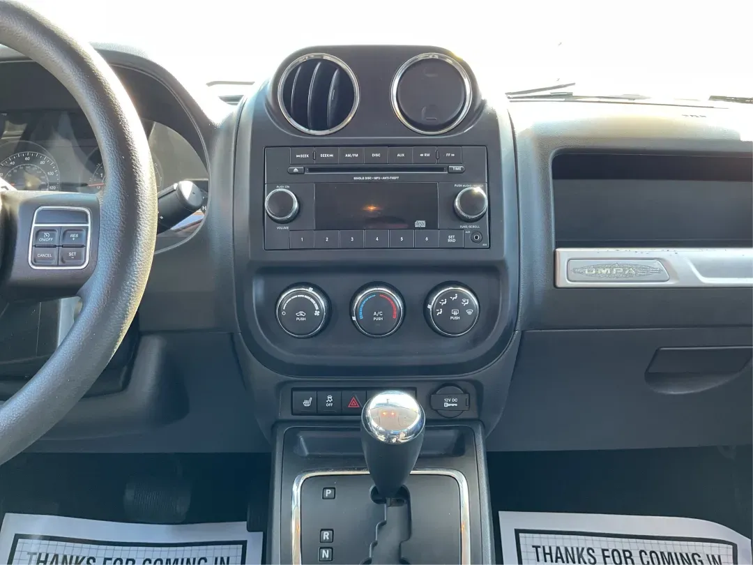 2015 Jeep Compass Altitude Edition (1C4NJCBA6FD) with an 2L I-4 DOHC engine, located at 8750 N County Rd 25A, Piqua, OH, 45356, (937) 908-9800, 40.164391, -84.232513 - **Adventure Awaits in the 2015 Jeep Compass Altitude Edition at Advantage Car and Credit - Fairborn!**<br /> <br /> Are you ready for your next adventure? The 2015 Jeep Compass Altitude Edition is your perfect companion for weekend getaways, family road trips, or even your daily commute! This versat - Photo#13