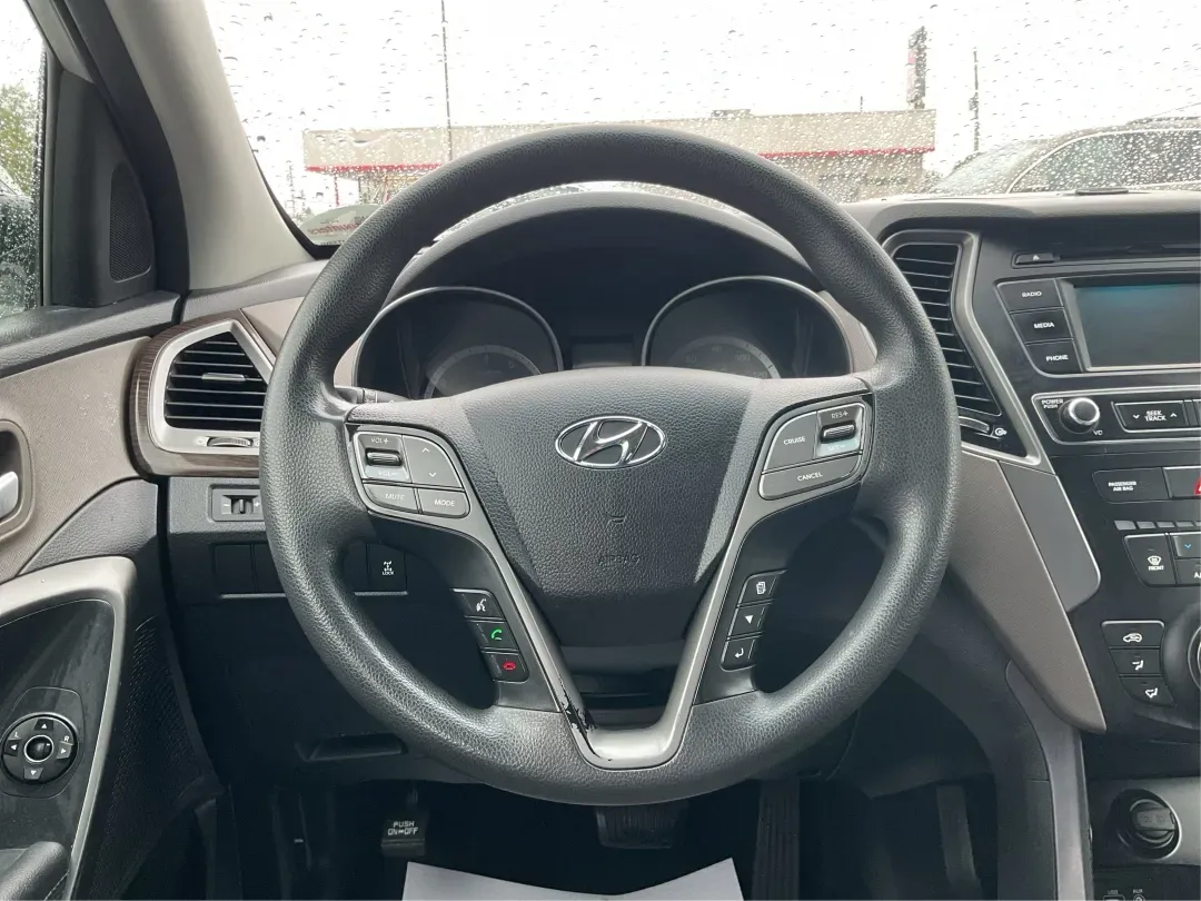 2017 Hyundai Santa Fe 2.4L (5XYZTDLB2HG) with an Theta II 2.4L I-4 gasoline direct injection engine, located at 1951 S Dayton Lakeview Rd., New Carlisle, OH, 45344, (937) 908-9800, 39.890999, -84.050255 - Discover the perfect blend of comfort, capability, and style with the 2017 Hyundai Santa Fe, now available at Advantage Car and Credit, located at 1184 Kauffman Ave, Fairborn, OH 45324. This versatile SUV is an excellent choice for growing families, weekend adventurers, or budget-conscious buyers lo - Photo#16