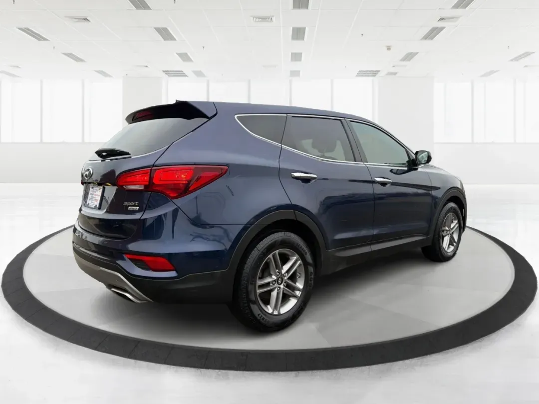2017 Hyundai Santa Fe 2.4L (5XYZTDLB6HG) with an Theta II 2.4L I-4 gasoline direct injection engine, located at 1099 N County Rd 25A, Troy, OH, 45373, (937) 908-9800, 40.057079, -84.212883 - **Experience Adventure and Comfort with the 2017 Hyundai Santa Fe at Advantage Car and Credit - Troy!**<br /> <br /> Are you searching for the perfect vehicle that accommodates your active lifestyle? Look no further! The 2017 Hyundai Santa Fe is the ideal SUV for families on the go, weekend adventur - Photo#2