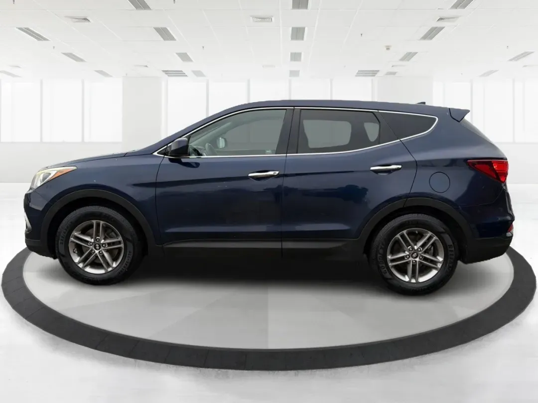 2017 Hyundai Santa Fe 2.4L (5XYZTDLB6HG) with an Theta II 2.4L I-4 gasoline direct injection engine, located at 1099 N County Rd 25A, Troy, OH, 45373, (937) 908-9800, 40.057079, -84.212883 - **Experience Adventure and Comfort with the 2017 Hyundai Santa Fe at Advantage Car and Credit - Troy!**<br /> <br /> Are you searching for the perfect vehicle that accommodates your active lifestyle? Look no further! The 2017 Hyundai Santa Fe is the ideal SUV for families on the go, weekend adventur - Photo#5