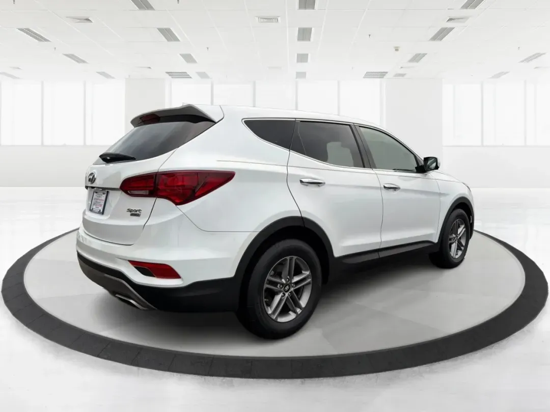 2017 Hyundai Santa Fe 2.4L (5NMZTDLB2HH) with an Theta II 2.4L I-4 gasoline direct injection engine, located at 1951 S Dayton Lakeview Rd., New Carlisle, OH, 45344, (937) 908-9800, 39.890999, -84.050255 - **Elevate Your Family Adventures with the 2017 Hyundai Santa Fe at Advantage Car and Credit!**<br /> <br /> Are you searching for the perfect vehicle to accommodate your growing family or to enhance your weekend getaways? Look no further! The 2017 Hyundai Santa Fe is a versatile and spacious SUV des - Photo#2