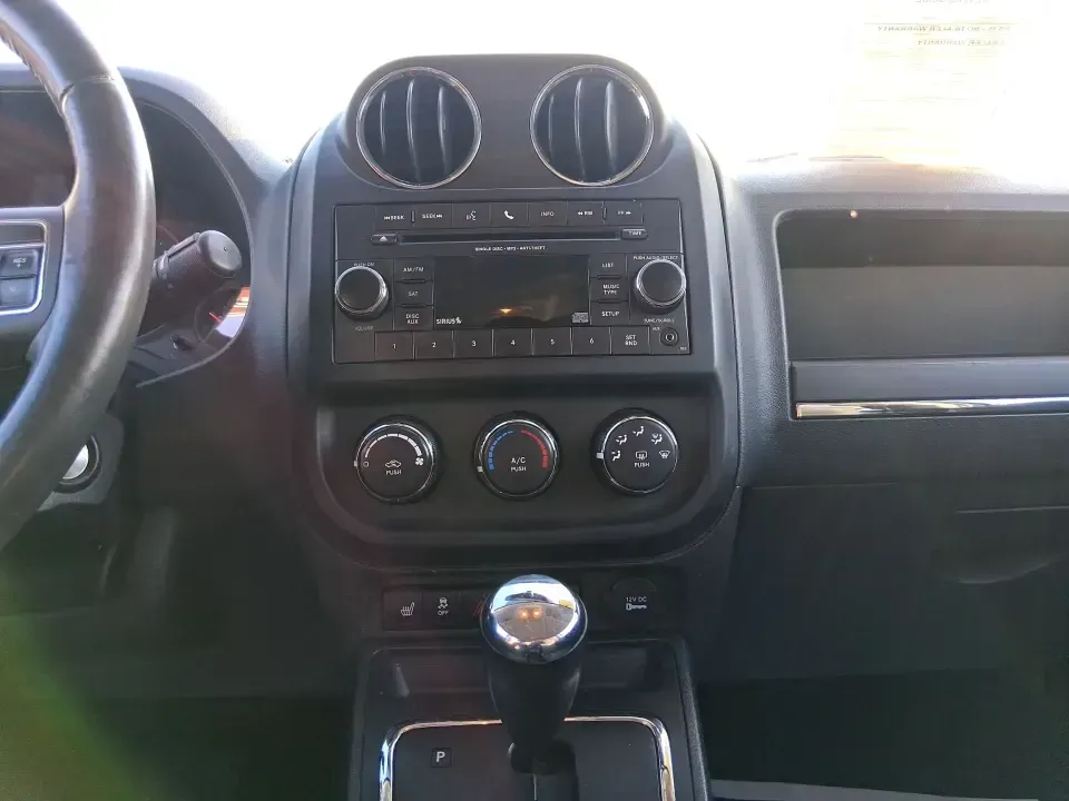 2012 Jeep Compass Latitude (1C4NJDEB4CD) with an 2.4L I-4 DOHC engine, Continuously Variable Transmission transmission, located at 4508 South Dixie Dr, Moraine, OH, 45439, (937) 908-9800, 39.689976, -84.218452 - Need a do-it-all SUV that fits real life in West Central Ohio-school drop-offs, long commutes up I75, and spontaneous weekend escapes to the trails around Johnston Farm and Indian Agency? This 2012 Jeep Compass Latitude 4WD in Bright White Clearcoat is built for that everyday adventure lifestyle, - Photo#12