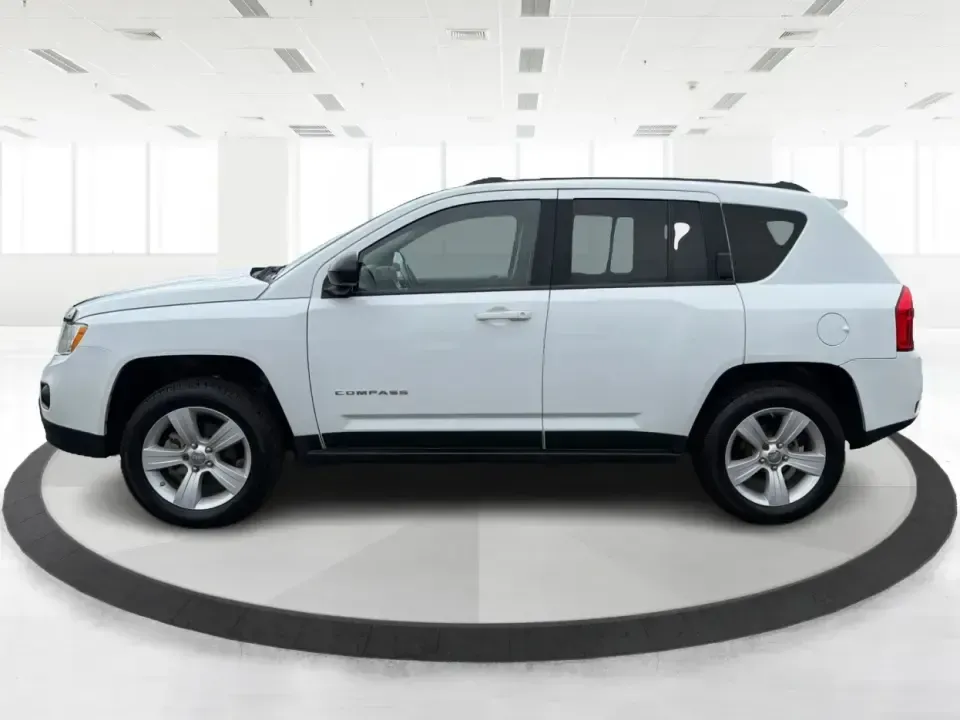 2012 Jeep Compass Latitude (1C4NJDEB4CD) with an 2.4L I-4 DOHC engine, Continuously Variable Transmission transmission, located at 1184 Kauffman Ave, Fairborn, OH, 45324, (937) 908-9800, 39.807072, -84.030914 - Need a do-it-all SUV that fits real life in West Central Ohio-school drop-offs, long commutes up I75, and spontaneous weekend escapes to the trails around Johnston Farm and Indian Agency? This 2012 Jeep Compass Latitude 4WD in Bright White Clearcoat is built for that everyday adventure lifestyle, - Photo#5