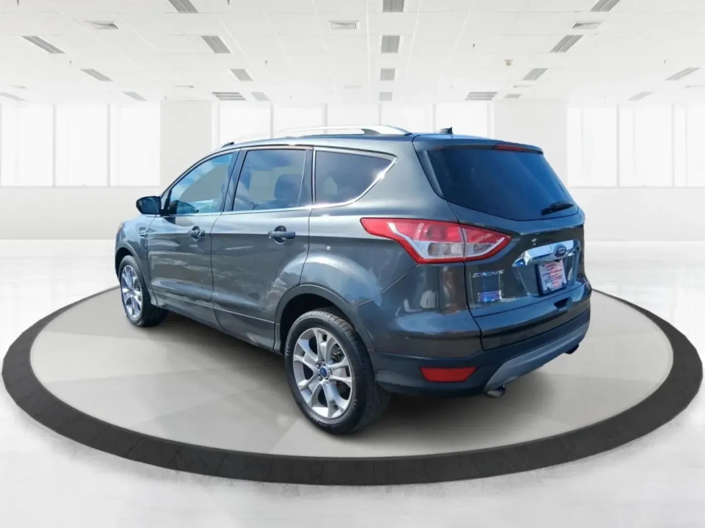 2016 Ford Escape Titanium (1FMCU9J94GU) with an 2.0L L4 DOHC 16V engine, 6-Speed Automatic transmission, located at 1951 S Dayton Lakeview Rd., New Carlisle, OH, 45344, (937) 908-9800, 39.890999, -84.050255 - Picture your next Ohio weekend: a quick grocery run through New Carlisle, a comfortable commute toward Dayton, and then a spontaneous road trip out I70 with the family-without worrying about weather, cargo space, or comfort. This 2016 Ford Escape Titanium in sleek Magnetic is the kind of compact SUV - Photo#4