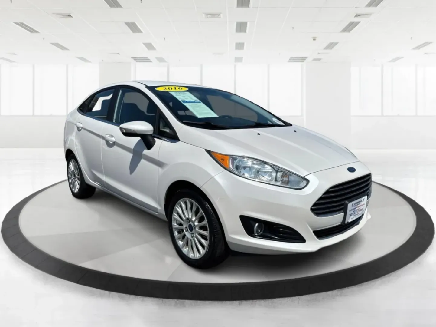 2016 Ford Fiesta Titanium (3FADP4CJ9GM) with an 1.6L I-4 DOHC engine, located at 880 E. National Road, Vandalia, OH, 45377, (937) 908-9800, 39.891918, -84.183594 - **Experience the Ultimate in Style and Comfort with the 2016 Ford Fiesta Titanium Sedan!**<br /> <br /> Are you looking for a stylish yet practical vehicle that fits seamlessly into your daily life? The 2016 Ford Fiesta Titanium Sedan is designed for those who crave sophistication without sacrificin - Photo#0