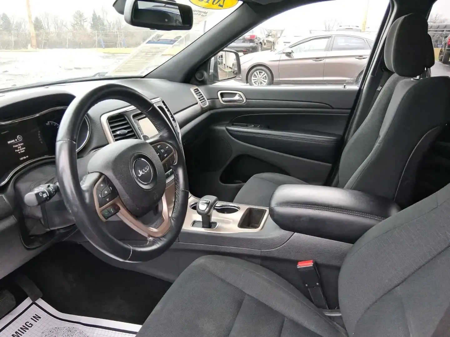 2015 Jeep Grand Cherokee Laredo (1C4RJFAG1FC) with an 3.6L V-6 DOHC engine, 8-Speed Automatic transmission, located at 1951 S Dayton Lakeview Rd., New Carlisle, OH, 45344, (937) 908-9800, 39.890999, -84.050255 - Picture a weekend that starts with a smooth commute through Clark County and ends with a spontaneous road trip-camp gear in the back, friends in the second row, and confidence when the weather turns. This 2015 Jeep Grand Cherokee Laredo is built for real life in Ohio: school runs, long drives down I - Photo#9