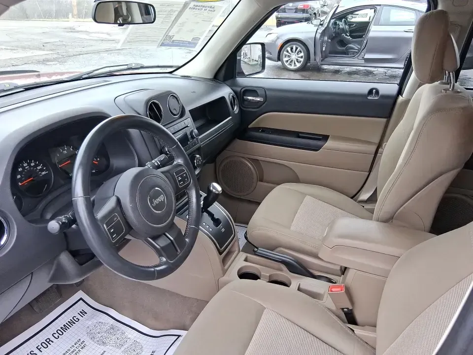 2012 Jeep Patriot Latitude (1C4NJPFB0CD) with an 2.4L L4 DOHC 16V engine, located at 1230 East Main St, Xenia, OH, 45385, (937) 908-9800, 39.688026, -83.910172 - Picture your next weekend: a quick run up I-75 for a family visit, a scenic drive past the Miami River, then an easy loop back through downtown Troy for dinner-without worrying about whether your SUV can keep up with daily life. This 2012 Jeep Patriot Latitude is built for practical adventures and e - Photo#9