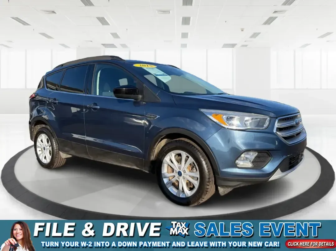 2018 Ford Escape SE (1FMCU9GD4JU) with an 1.5L L4 DOHC 16V engine, 6A transmission, located at 880 E. National Road, Vandalia, OH, 45377, (937) 908-9800, 39.891918, -84.183594 - Picture your next Ohio weekend: loading up the kids for a splash at Splash Xenia, cruising out to John Bryan State Park for a hike, or tackling a snowy morning commute from Beavercreek to downtown Dayton with confidence. This 2018 Ford Escape SE in Blue Metallic is the kind of compact SUV that fits - Photo#0