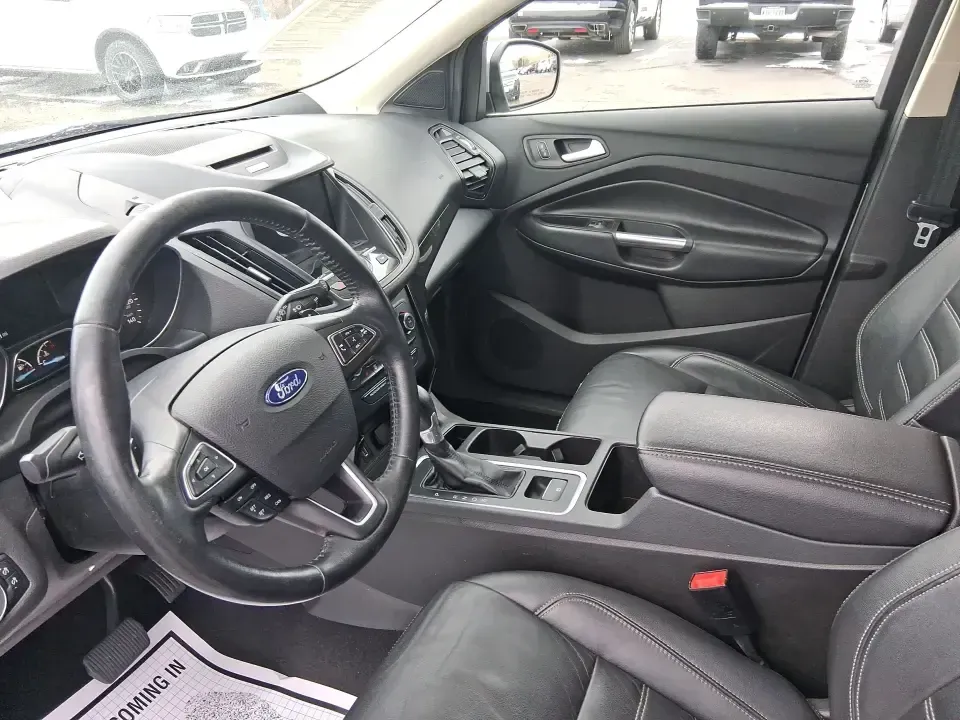2017 Ford Escape Titanium (1FMCU9J9XHU) with an 2.0L L4 DOHC 16V engine, 6A transmission, located at 4508 South Dixie Dr, Moraine, OH, 45439, (937) 908-9800, 39.689976, -84.218452 - Picture your next Ohio weekend: a comfortable SUV loaded with gear, cruising down I-75 for a quick Dayton outing, then turning toward the MetroParks for a hike-without worrying about winter weather, tight parking lots, or long-drive fatigue. This 2017 Ford Escape Titanium is built for real life in M - Photo#9