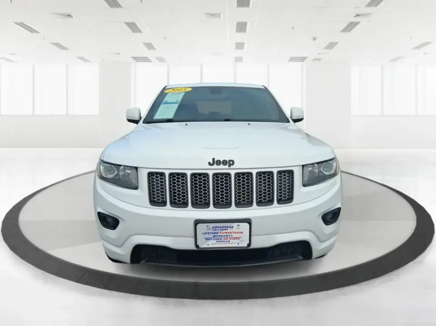 2015 Jeep Grand Cherokee Altitude (1C4RJFAG9FC) with an 3.6L V-6 DOHC engine, 8-Speed Automatic transmission, located at 1099 N County Rd 25A, Troy, OH, 45373, (937) 908-9800, 40.057079, -84.212883 - Weekend getaways to Hocking Hills, snowy school runs, or a confident daily commute up I75 feel easier when your SUV is built for real Ohio weather and real-life schedules. This 2015 Jeep Grand Cherokee Altitude in Bright White Clearcoat is the kind of capable, comfortable SUV that fits busy families - Photo#7