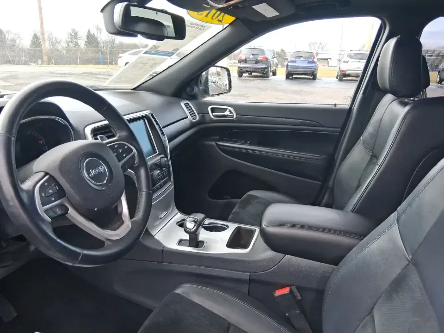 2015 Jeep Grand Cherokee Altitude (1C4RJFAG9FC) with an 3.6L V-6 DOHC engine, 8-Speed Automatic transmission, located at 1099 N County Rd 25A, Troy, OH, 45373, (937) 908-9800, 40.057079, -84.212883 - Weekend getaways to Hocking Hills, snowy school runs, or a confident daily commute up I75 feel easier when your SUV is built for real Ohio weather and real-life schedules. This 2015 Jeep Grand Cherokee Altitude in Bright White Clearcoat is the kind of capable, comfortable SUV that fits busy families - Photo#9