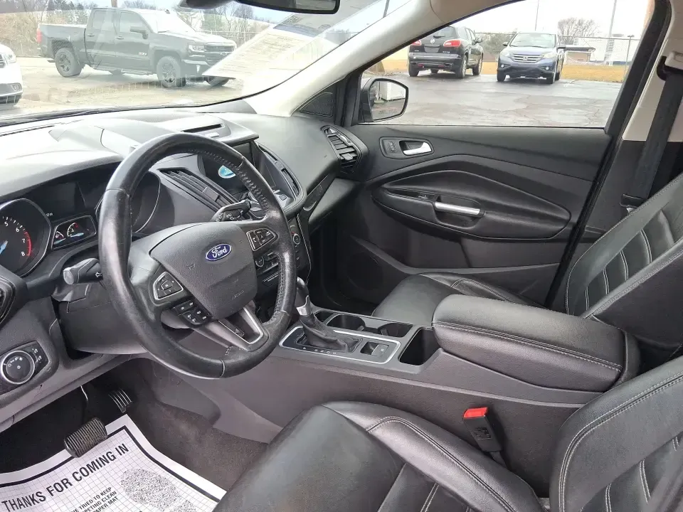 2017 Ford Escape Titanium (1FMCU9J94HU) with an 2.0L L4 DOHC 16V engine, 6A transmission, located at 8750 N County Rd 25A, Piqua, OH, 45356, (937) 908-9800, 40.164391, -84.232513 - Pack the gear, load up the family, and point the GPS toward your next weekend escape-this 2017 Ford Escape Titanium is the kind of compact SUV that fits real life in Piqua. Whether you're commuting up I75, running errands along N County Rd 25A, or planning a day trip to Lock 9 Park and the Great Mia - Photo#9