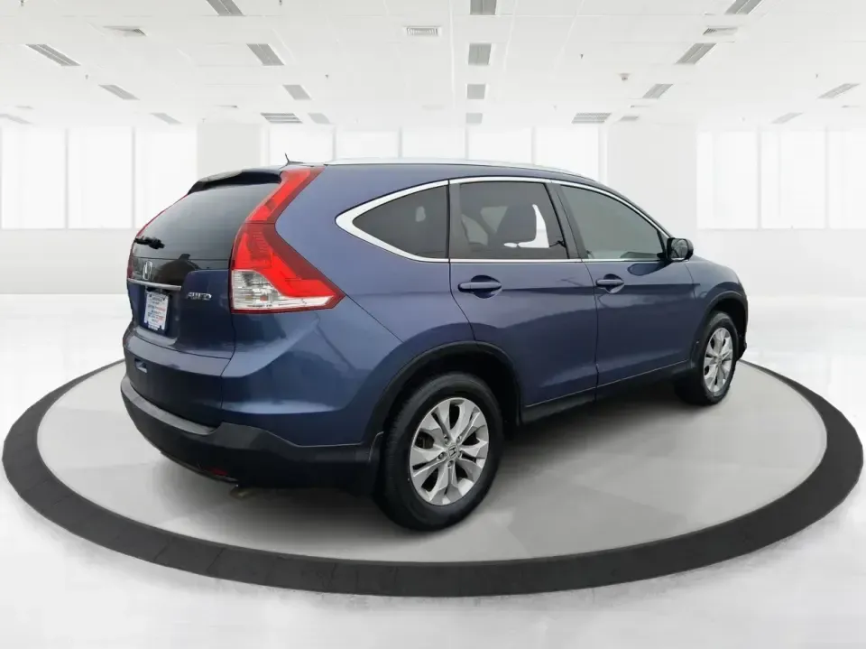 2013 Honda CR-V EX-L (2HKRM4H74DH) with an 2.4L I-4 DOHC engine, 5-Speed Automatic transmission, located at 1184 Kauffman Ave, Fairborn, OH, 45324, (937) 908-9800, 39.807072, -84.030914 - Picture your next weekend: a quick run up I75 for a Dayton Dragons game, a family trip to Treasure Island Park, or a snowy school-morning commute across Troy-without stressing about space, comfort, or traction. This 2013 Honda CRV EXL in Twilight Blue Metallic is the kind of do-it-all SUV that fits - Photo#2