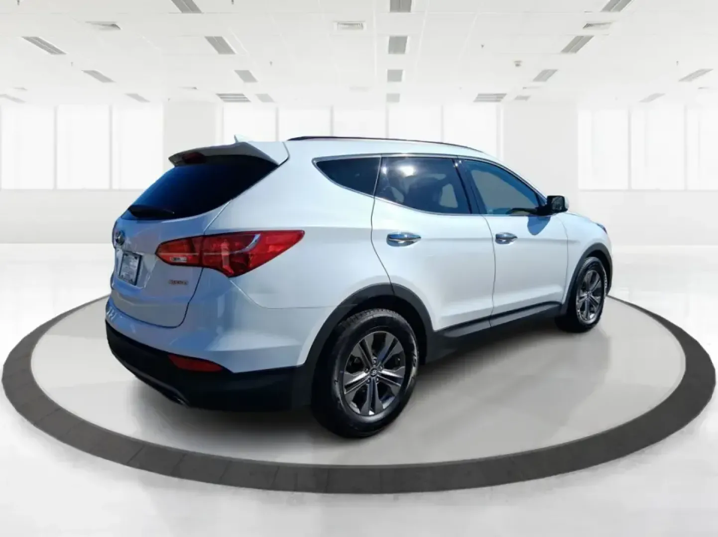 2013 Hyundai Santa Fe Sport (5XYZU3LB7DG) with an Theta II 2.4L I-4 gasoline direct injection engine, 6-Speed Automatic transmission, located at 1951 S Dayton Lakeview Rd., New Carlisle, OH, 45344, (937) 908-9800, 39.890999, -84.050255 - Need one SUV that can handle school drop-offs, I75 commutes, and a weekend escape to Taylorsville MetroPark without draining your budget? This 2013 Hyundai Santa Fe Sport is a smart, road-trip-ready crossover that blends everyday practicality with comfort features you'll appreciate on longer drives - Photo#2
