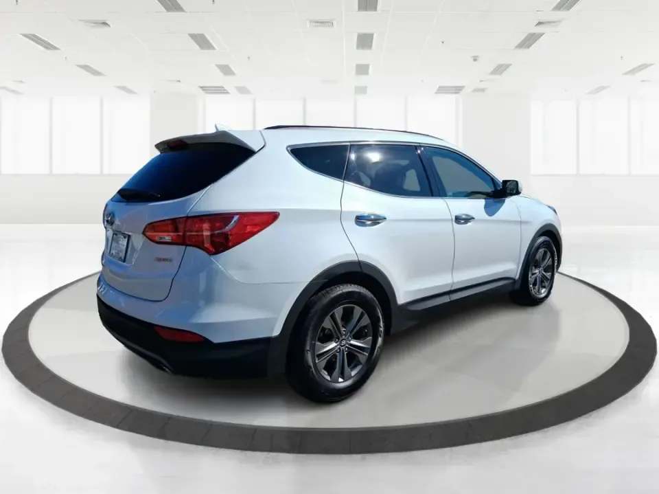 2013 Hyundai Santa Fe Sport (5XYZU3LB7DG) with an Theta II 2.4L I-4 gasoline direct injection engine, 6-Speed Automatic transmission, located at 1951 S Dayton Lakeview Rd., New Carlisle, OH, 45344, (937) 908-9800, 39.890999, -84.050255 - Need one SUV that can handle school drop-offs, I75 commutes, and a weekend escape to Taylorsville MetroPark without draining your budget? This 2013 Hyundai Santa Fe Sport is a smart, road-trip-ready crossover that blends everyday practicality with comfort features you'll appreciate on longer drives - Photo#2