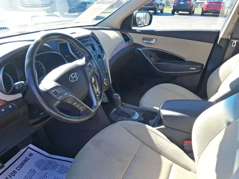 2013 Hyundai Santa Fe Sport (5XYZU3LB7DG) with an Theta II 2.4L I-4 gasoline direct injection engine, 6-Speed Automatic transmission, located at 1951 S Dayton Lakeview Rd., New Carlisle, OH, 45344, (937) 908-9800, 39.890999, -84.050255 - Need one SUV that can handle school drop-offs, I75 commutes, and a weekend escape to Taylorsville MetroPark without draining your budget? This 2013 Hyundai Santa Fe Sport is a smart, road-trip-ready crossover that blends everyday practicality with comfort features you'll appreciate on longer drives - Photo#9