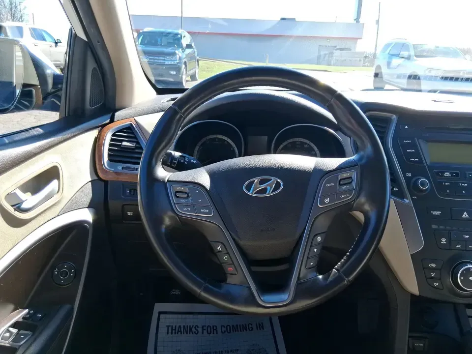 2013 Hyundai Santa Fe Sport (5XYZU3LB7DG) with an Theta II 2.4L I-4 gasoline direct injection engine, 6-Speed Automatic transmission, located at 1951 S Dayton Lakeview Rd., New Carlisle, OH, 45344, (937) 908-9800, 39.890999, -84.050255 - Need one SUV that can handle school drop-offs, I75 commutes, and a weekend escape to Taylorsville MetroPark without draining your budget? This 2013 Hyundai Santa Fe Sport is a smart, road-trip-ready crossover that blends everyday practicality with comfort features you'll appreciate on longer drives - Photo#16