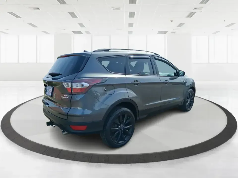 2017 Ford Escape SE (1FMCU9GD2HU) with an 1.5L L4 DOHC 16V engine, 6A transmission, located at 880 E. National Road, Vandalia, OH, 45377, (937) 908-9800, 39.891918, -84.183594 - Make every day easier-whether you're tackling a long commute up I-75, shuttling kids between school and practice, or packing up for a weekend escape to the Dayton area parks. This 2017 Ford Escape SE in Magnetic Metallic is the kind of compact SUV that fits real life in Vandalia, OH: easy to park, c - Photo#2