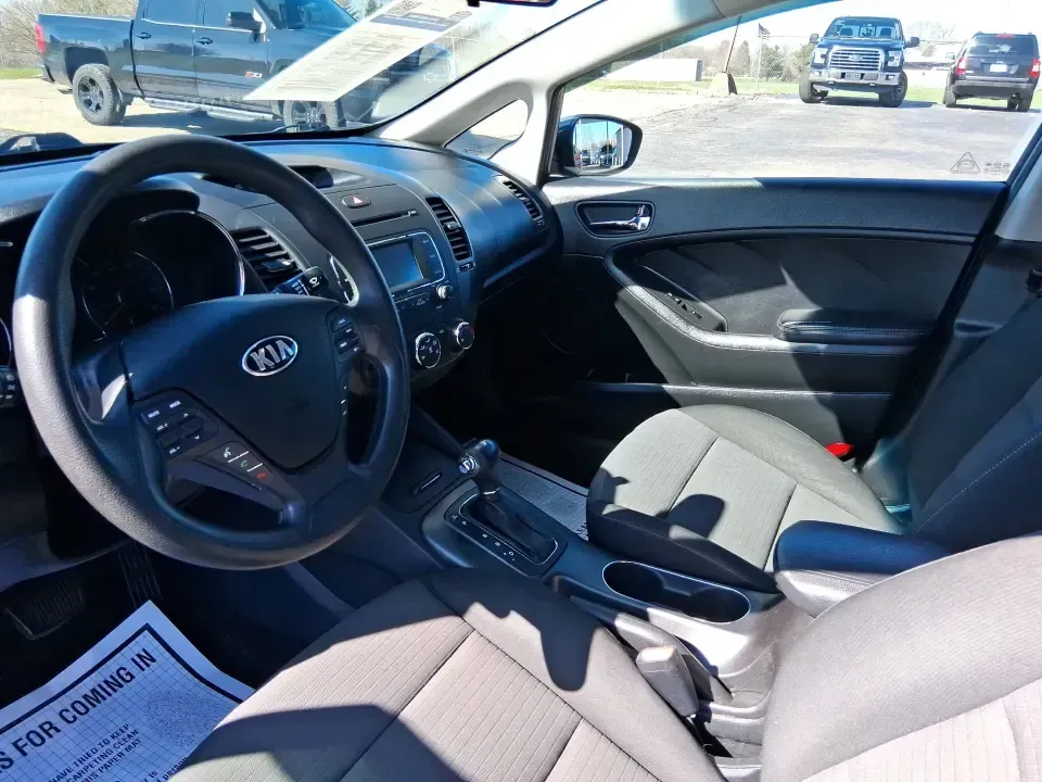 2016 Kia Forte LX (KNAFX4A63G5) with an 1.8L I-4 DOHC engine, 6-Speed Automatic transmission, located at 1951 S Dayton Lakeview Rd., New Carlisle, OH, 45344, (937) 908-9800, 39.890999, -84.050255 - Need a dependable commuter that still feels comfortable for weekend plans around the Miami Valley? This **2016 Kia Forte LX** in **Steel Blue Metallic** is a smart, budget-friendly sedan that fits real life in **Fairborn, Ohio**-whether you're driving to Wright-Patterson AFB, heading to class, or cr - Photo#9