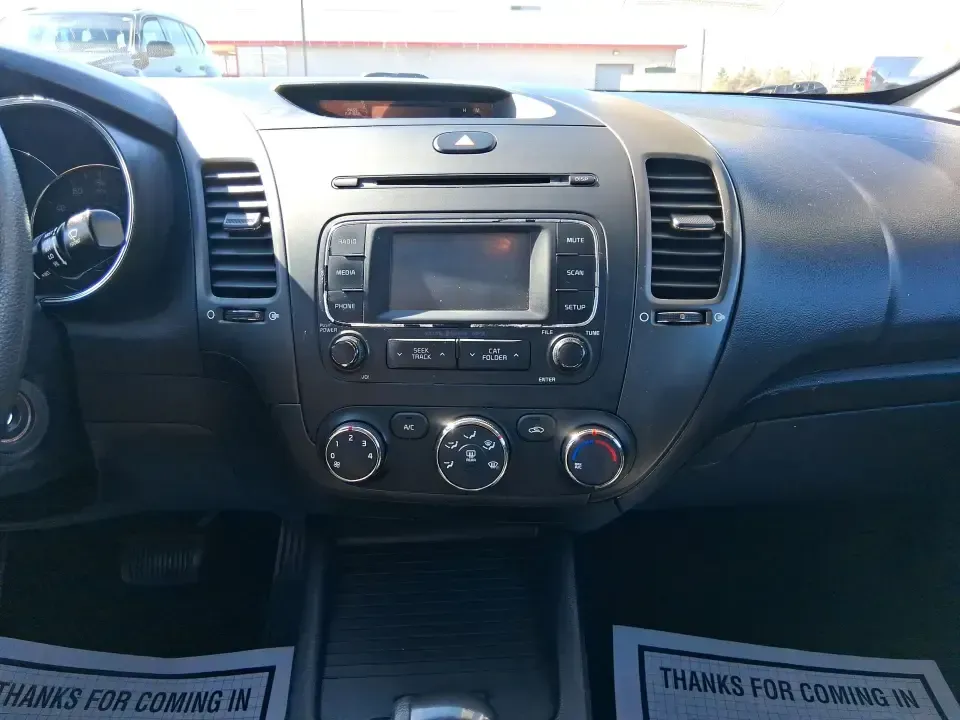 2016 Kia Forte LX (KNAFX4A63G5) with an 1.8L I-4 DOHC engine, 6-Speed Automatic transmission, located at 1951 S Dayton Lakeview Rd., New Carlisle, OH, 45344, (937) 908-9800, 39.890999, -84.050255 - Need a dependable commuter that still feels comfortable for weekend plans around the Miami Valley? This **2016 Kia Forte LX** in **Steel Blue Metallic** is a smart, budget-friendly sedan that fits real life in **Fairborn, Ohio**-whether you're driving to Wright-Patterson AFB, heading to class, or cr - Photo#13