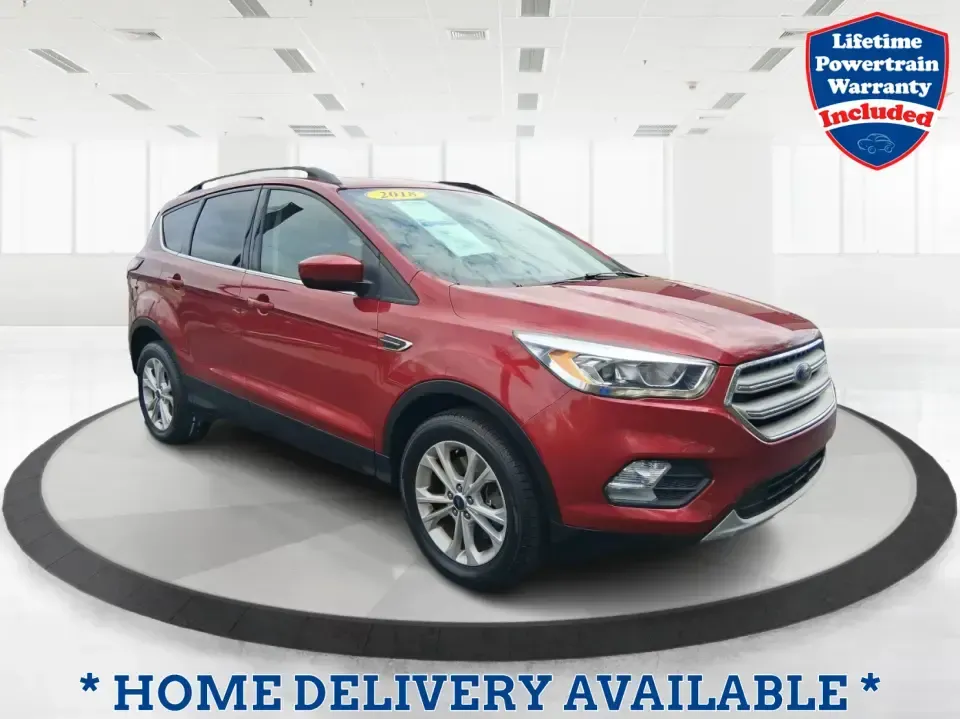 2018 Ford Escape SEL (1FMCU9HD2JU) with an 1.5L L4 DOHC 16V engine, 6A transmission, located at 4508 South Dixie Dr, Moraine, OH, 45439, (937) 908-9800, 39.689976, -84.218452 - Need a do-it-all SUV that can handle the weekday commute on I-675, quick school drop-offs near Wright-Patterson AFB, and spontaneous weekend getaways to Carillon Historical Park or a lap around Eastwood MetroPark? This 2018 Ford Escape SEL in Ruby Red Metallic Tinted Clearcoat is built for real-life - Photo#0
