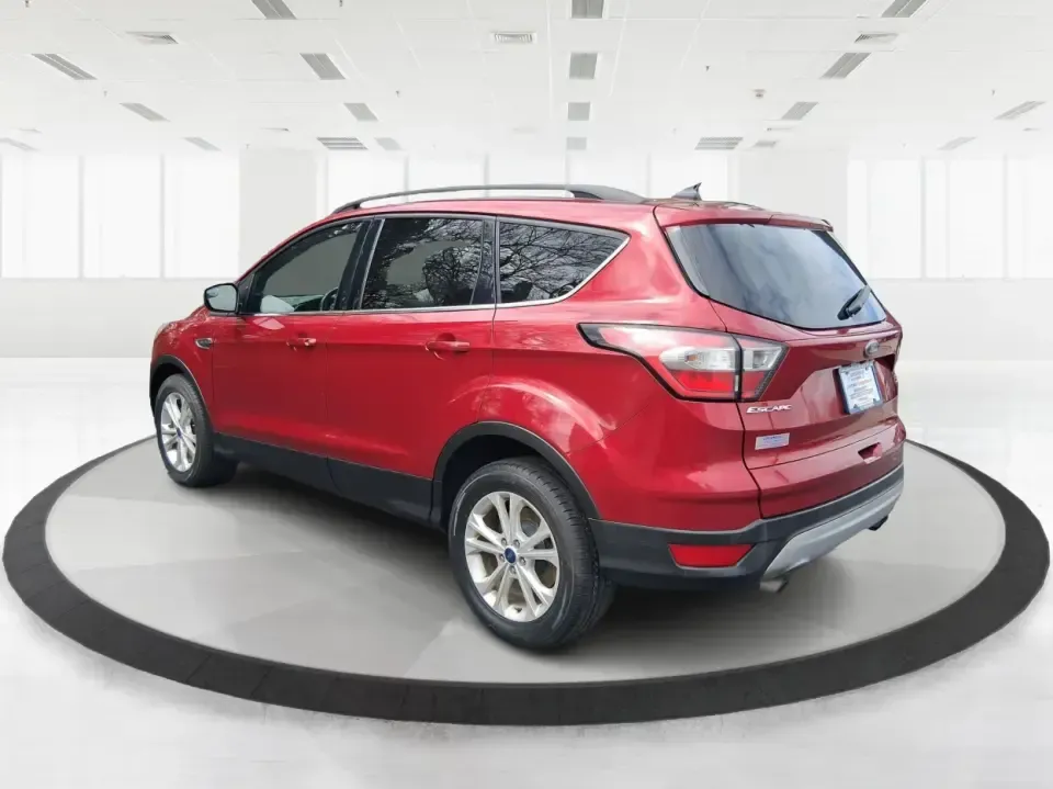 2018 Ford Escape SEL (1FMCU9HD2JU) with an 1.5L L4 DOHC 16V engine, 6A transmission, located at 4508 South Dixie Dr, Moraine, OH, 45439, (937) 908-9800, 39.689976, -84.218452 - Need a do-it-all SUV that can handle the weekday commute on I-675, quick school drop-offs near Wright-Patterson AFB, and spontaneous weekend getaways to Carillon Historical Park or a lap around Eastwood MetroPark? This 2018 Ford Escape SEL in Ruby Red Metallic Tinted Clearcoat is built for real-life - Photo#4