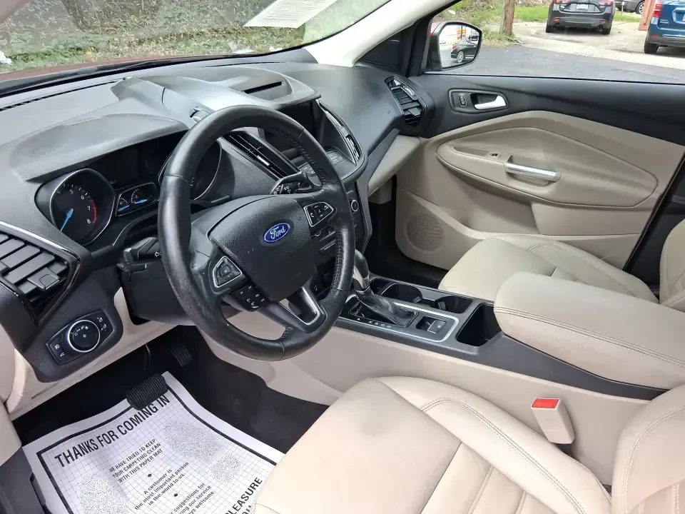 2018 Ford Escape SEL (1FMCU9HD2JU) with an 1.5L L4 DOHC 16V engine, 6A transmission, located at 4508 South Dixie Dr, Moraine, OH, 45439, (937) 908-9800, 39.689976, -84.218452 - Need a do-it-all SUV that can handle the weekday commute on I-675, quick school drop-offs near Wright-Patterson AFB, and spontaneous weekend getaways to Carillon Historical Park or a lap around Eastwood MetroPark? This 2018 Ford Escape SEL in Ruby Red Metallic Tinted Clearcoat is built for real-life - Photo#9