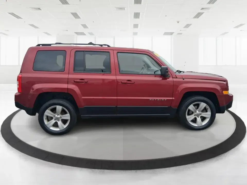 2014 Jeep Patriot Latitude 2WD (1C4NJPFB3ED) with an 2.4L L4 DOHC 16V engine, located at 8750 N County Rd 25A, Piqua, OH, 45356, (937) 908-9800, 40.164391, -84.232513 - Picture a weekday commute down I70 followed by a Saturday escape to parks and backroads around Clark County-this 2014 Jeep Patriot Latitude is the kind of compact SUV that fits both routines without feeling oversized. Finished in Deep Cherry Red Crystal Pearlcoat and showing 90,565 miles, it's a pra - Photo#1