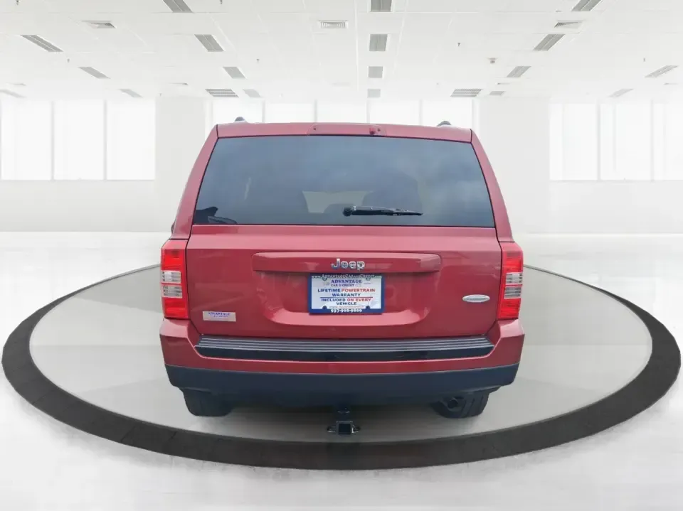 2014 Jeep Patriot Latitude 2WD (1C4NJPFB3ED) with an 2.4L L4 DOHC 16V engine, located at 8750 N County Rd 25A, Piqua, OH, 45356, (937) 908-9800, 40.164391, -84.232513 - Picture a weekday commute down I70 followed by a Saturday escape to parks and backroads around Clark County-this 2014 Jeep Patriot Latitude is the kind of compact SUV that fits both routines without feeling oversized. Finished in Deep Cherry Red Crystal Pearlcoat and showing 90,565 miles, it's a pra - Photo#3