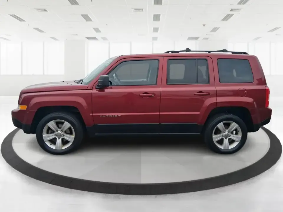 2014 Jeep Patriot Latitude 2WD (1C4NJPFB3ED) with an 2.4L L4 DOHC 16V engine, located at 8750 N County Rd 25A, Piqua, OH, 45356, (937) 908-9800, 40.164391, -84.232513 - Picture a weekday commute down I70 followed by a Saturday escape to parks and backroads around Clark County-this 2014 Jeep Patriot Latitude is the kind of compact SUV that fits both routines without feeling oversized. Finished in Deep Cherry Red Crystal Pearlcoat and showing 90,565 miles, it's a pra - Photo#5