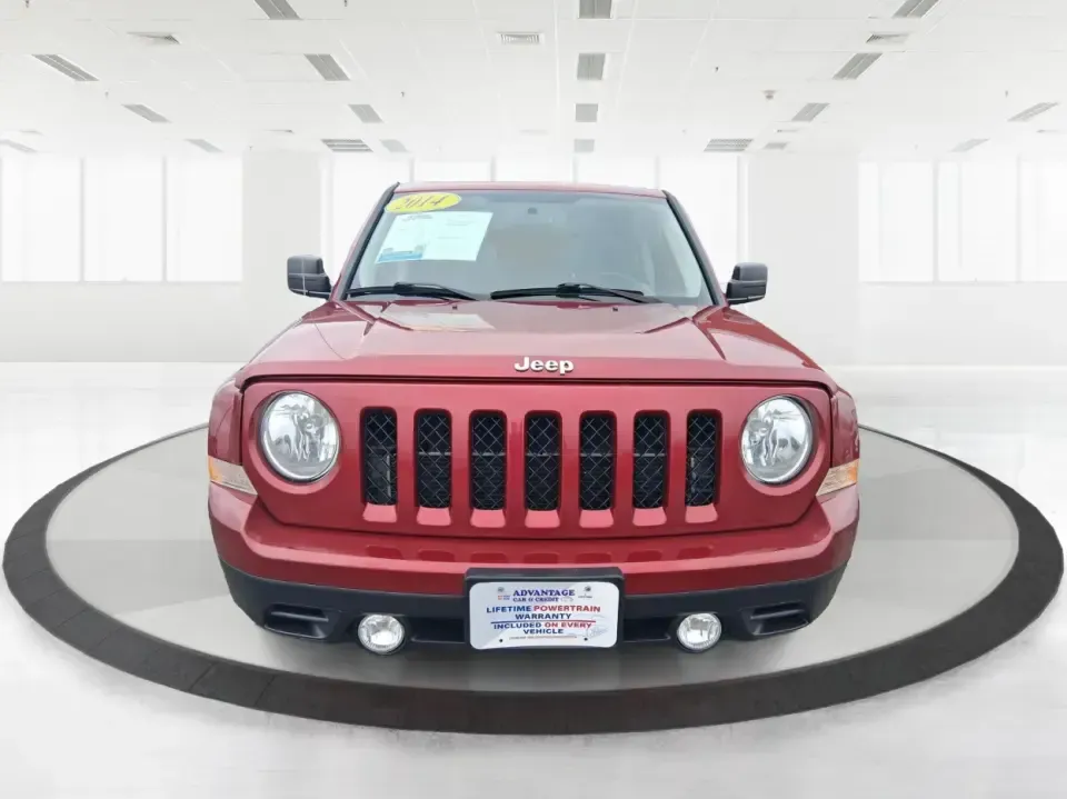 2014 Jeep Patriot Latitude 2WD (1C4NJPFB3ED) with an 2.4L L4 DOHC 16V engine, located at 8750 N County Rd 25A, Piqua, OH, 45356, (937) 908-9800, 40.164391, -84.232513 - Picture a weekday commute down I70 followed by a Saturday escape to parks and backroads around Clark County-this 2014 Jeep Patriot Latitude is the kind of compact SUV that fits both routines without feeling oversized. Finished in Deep Cherry Red Crystal Pearlcoat and showing 90,565 miles, it's a pra - Photo#7