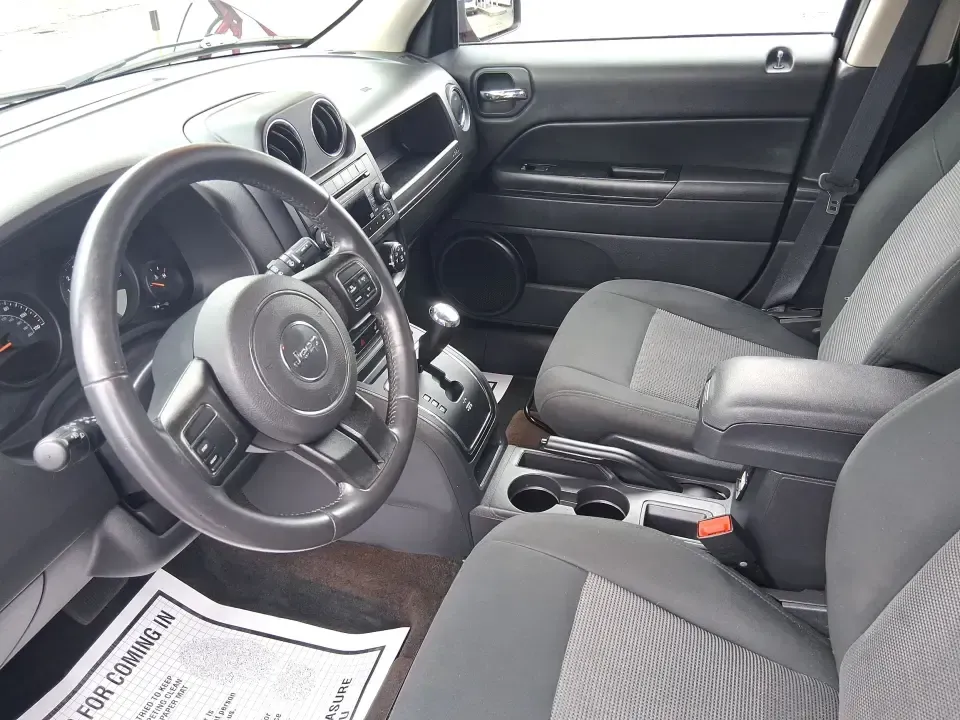 2014 Jeep Patriot Latitude 2WD (1C4NJPFB3ED) with an 2.4L L4 DOHC 16V engine, located at 8750 N County Rd 25A, Piqua, OH, 45356, (937) 908-9800, 40.164391, -84.232513 - Picture a weekday commute down I70 followed by a Saturday escape to parks and backroads around Clark County-this 2014 Jeep Patriot Latitude is the kind of compact SUV that fits both routines without feeling oversized. Finished in Deep Cherry Red Crystal Pearlcoat and showing 90,565 miles, it's a pra - Photo#9