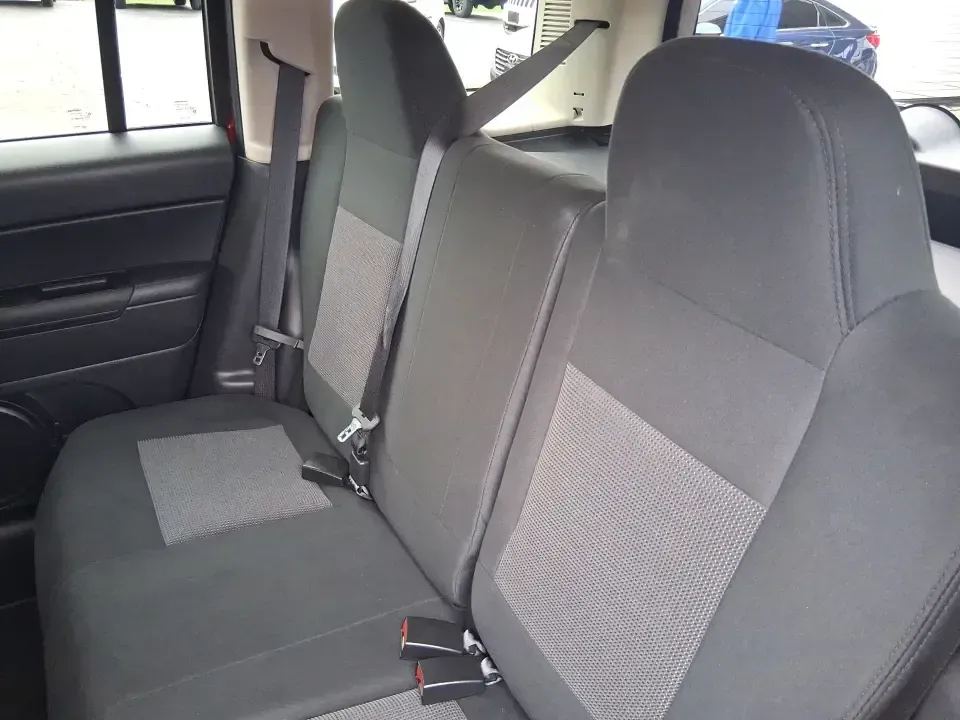 2014 Jeep Patriot Latitude 2WD (1C4NJPFB3ED) with an 2.4L L4 DOHC 16V engine, located at 8750 N County Rd 25A, Piqua, OH, 45356, (937) 908-9800, 40.164391, -84.232513 - Picture a weekday commute down I70 followed by a Saturday escape to parks and backroads around Clark County-this 2014 Jeep Patriot Latitude is the kind of compact SUV that fits both routines without feeling oversized. Finished in Deep Cherry Red Crystal Pearlcoat and showing 90,565 miles, it's a pra - Photo#10