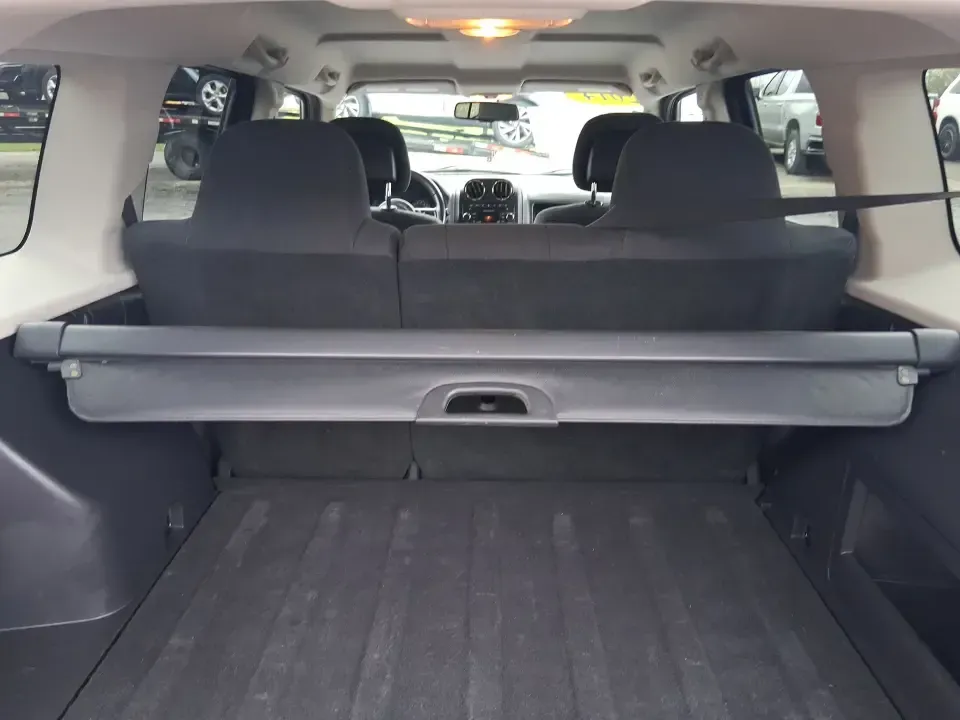 2014 Jeep Patriot Latitude 2WD (1C4NJPFB3ED) with an 2.4L L4 DOHC 16V engine, located at 8750 N County Rd 25A, Piqua, OH, 45356, (937) 908-9800, 40.164391, -84.232513 - Picture a weekday commute down I70 followed by a Saturday escape to parks and backroads around Clark County-this 2014 Jeep Patriot Latitude is the kind of compact SUV that fits both routines without feeling oversized. Finished in Deep Cherry Red Crystal Pearlcoat and showing 90,565 miles, it's a pra - Photo#12