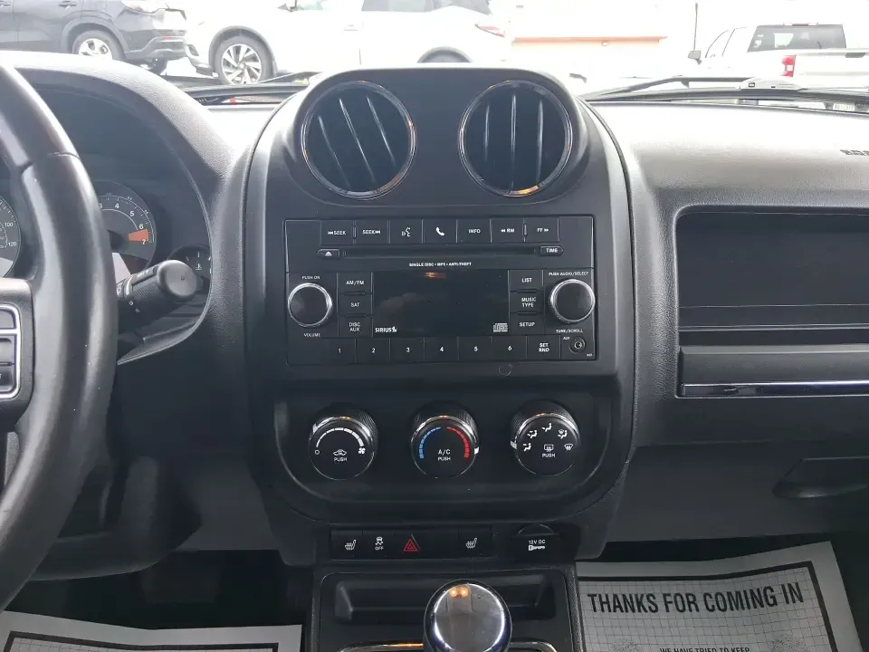 2014 Jeep Patriot Latitude 2WD (1C4NJPFB3ED) with an 2.4L L4 DOHC 16V engine, located at 8750 N County Rd 25A, Piqua, OH, 45356, (937) 908-9800, 40.164391, -84.232513 - Picture a weekday commute down I70 followed by a Saturday escape to parks and backroads around Clark County-this 2014 Jeep Patriot Latitude is the kind of compact SUV that fits both routines without feeling oversized. Finished in Deep Cherry Red Crystal Pearlcoat and showing 90,565 miles, it's a pra - Photo#13