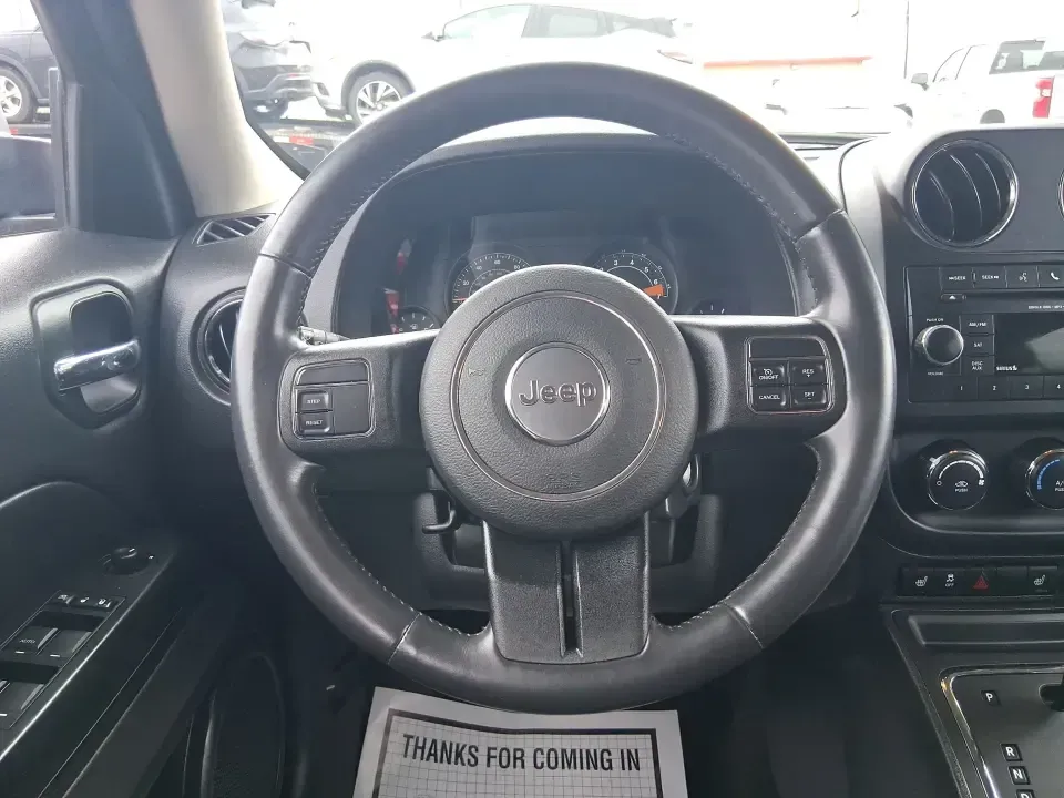 2014 Jeep Patriot Latitude 2WD (1C4NJPFB3ED) with an 2.4L L4 DOHC 16V engine, located at 8750 N County Rd 25A, Piqua, OH, 45356, (937) 908-9800, 40.164391, -84.232513 - Picture a weekday commute down I70 followed by a Saturday escape to parks and backroads around Clark County-this 2014 Jeep Patriot Latitude is the kind of compact SUV that fits both routines without feeling oversized. Finished in Deep Cherry Red Crystal Pearlcoat and showing 90,565 miles, it's a pra - Photo#16