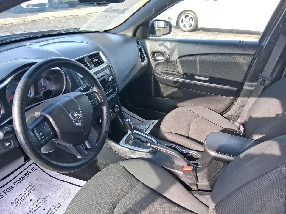 2014 Dodge Avenger SE (1C3CDZAB8EN) with an 2.4L L4 DOHC 16V engine, 4-Speed Automatic transmission, located at 1099 N County Rd 25A, Troy, OH, 45373, (937) 908-9800, 40.057079, -84.212883 - Need a dependable sedan for the daily drive from Troy to Dayton, quick school drop-offs, or comfortable weekend runs up I75? This 2014 Dodge Avenger SE is built for real-life Ohio schedules-easy to park downtown, roomy enough for five, and efficient for commuting along N County Rd 25A, Main Street,- Photo#9
