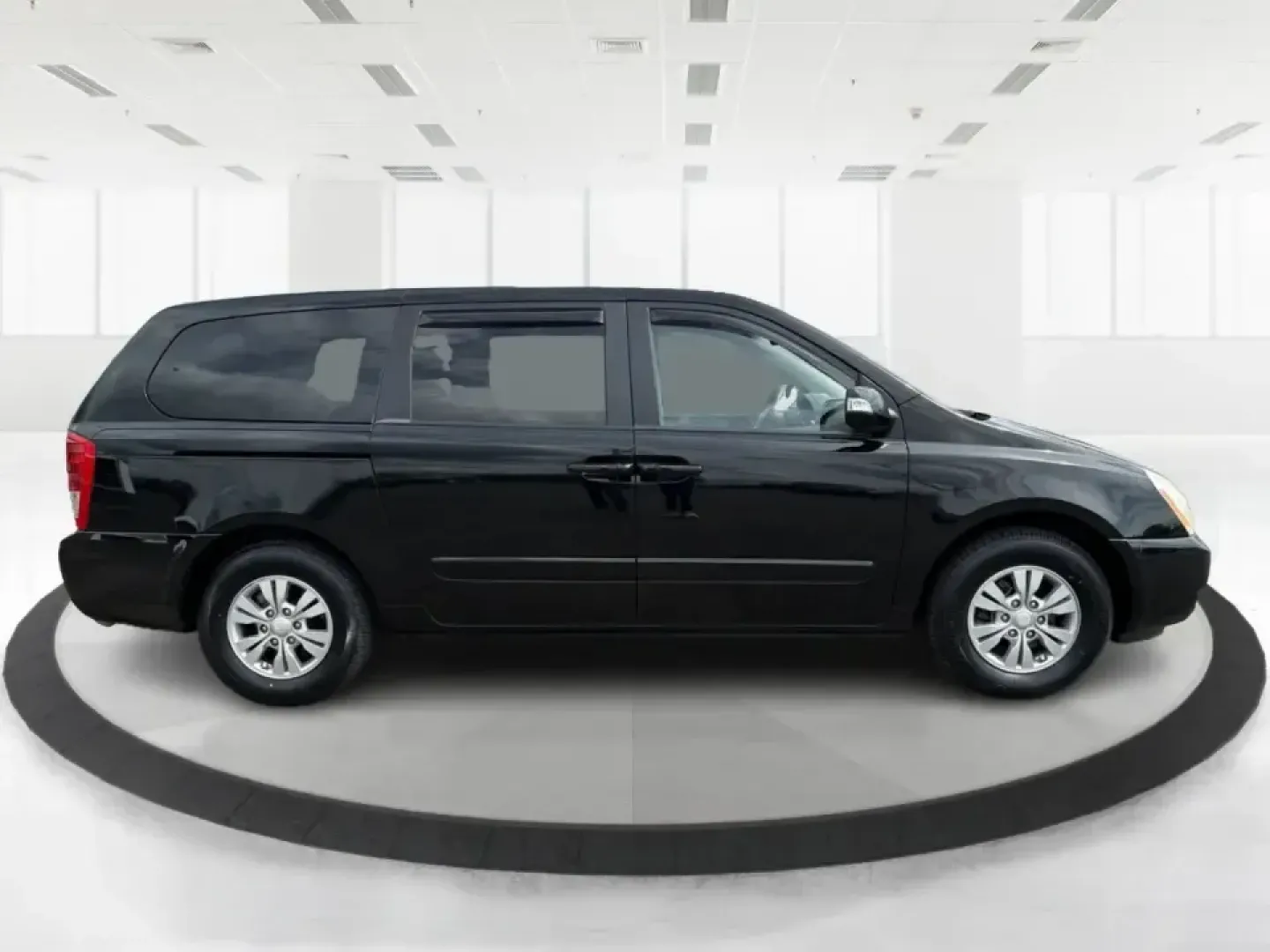 2012 Kia Sedona LX (KNDMG4C78C6) with an 3.5L V-6 DOHC engine, 5-Speed Automatic transmission, located at 1184 Kauffman Ave, Fairborn, OH, 45324, (937) 908-9800, 39.807072, -84.030914 - Picture the next family road trip, soccer Saturday, or airport pickup where everyone actually fits comfortably-plus there's room left for groceries, strollers, and weekend gear. This 2012 Kia Sedona LX in Aurora Black is built for real life: school drop-offs, long commutes across the Miami Valley, a - Photo#1