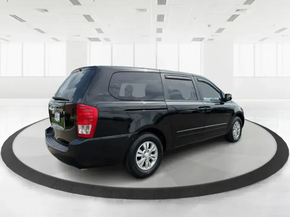 2012 Kia Sedona LX (KNDMG4C78C6) with an 3.5L V-6 DOHC engine, 5-Speed Automatic transmission, located at 401 Woodman Dr, Riverside, OH, 45431, (937) 908-9800, 39.760899, -84.123421 - Picture the next family road trip, soccer Saturday, or airport pickup where everyone actually fits comfortably-plus there's room left for groceries, strollers, and weekend gear. This 2012 Kia Sedona LX in Aurora Black is built for real life: school drop-offs, long commutes across the Miami Valley, a - Photo#2