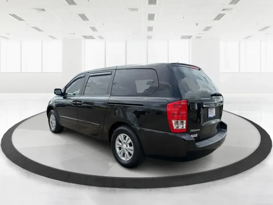 2012 Kia Sedona LX (KNDMG4C78C6) with an 3.5L V-6 DOHC engine, 5-Speed Automatic transmission, located at 401 Woodman Dr, Riverside, OH, 45431, (937) 908-9800, 39.760899, -84.123421 - Picture the next family road trip, soccer Saturday, or airport pickup where everyone actually fits comfortably-plus there's room left for groceries, strollers, and weekend gear. This 2012 Kia Sedona LX in Aurora Black is built for real life: school drop-offs, long commutes across the Miami Valley, a - Photo#4