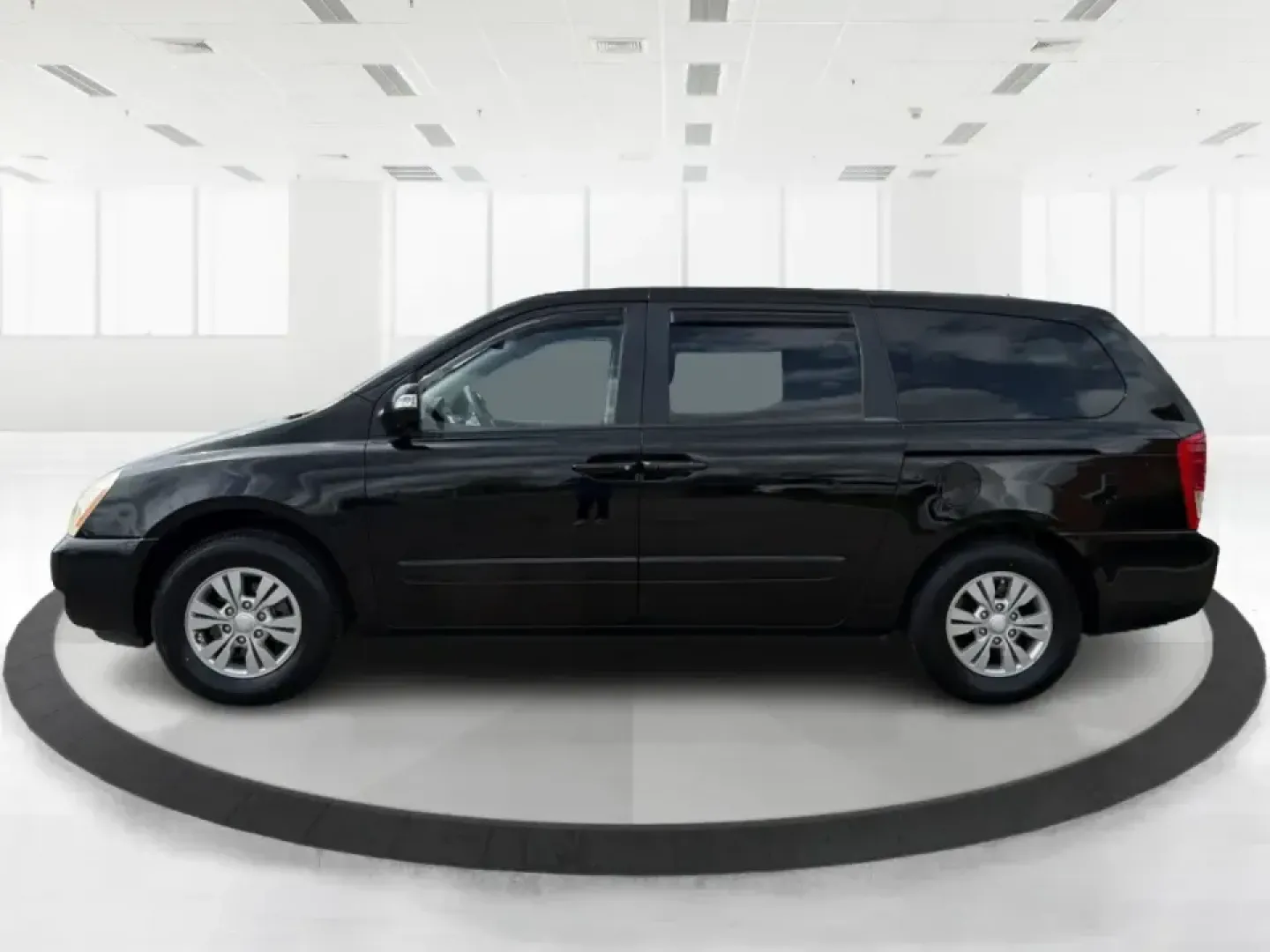 2012 Kia Sedona LX (KNDMG4C78C6) with an 3.5L V-6 DOHC engine, 5-Speed Automatic transmission, located at 1184 Kauffman Ave, Fairborn, OH, 45324, (937) 908-9800, 39.807072, -84.030914 - Picture the next family road trip, soccer Saturday, or airport pickup where everyone actually fits comfortably-plus there's room left for groceries, strollers, and weekend gear. This 2012 Kia Sedona LX in Aurora Black is built for real life: school drop-offs, long commutes across the Miami Valley, a - Photo#5