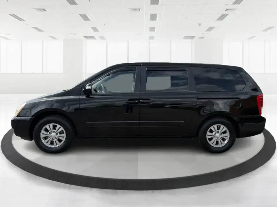 2012 Kia Sedona LX (KNDMG4C78C6) with an 3.5L V-6 DOHC engine, 5-Speed Automatic transmission, located at 401 Woodman Dr, Riverside, OH, 45431, (937) 908-9800, 39.760899, -84.123421 - Picture the next family road trip, soccer Saturday, or airport pickup where everyone actually fits comfortably-plus there's room left for groceries, strollers, and weekend gear. This 2012 Kia Sedona LX in Aurora Black is built for real life: school drop-offs, long commutes across the Miami Valley, a - Photo#5