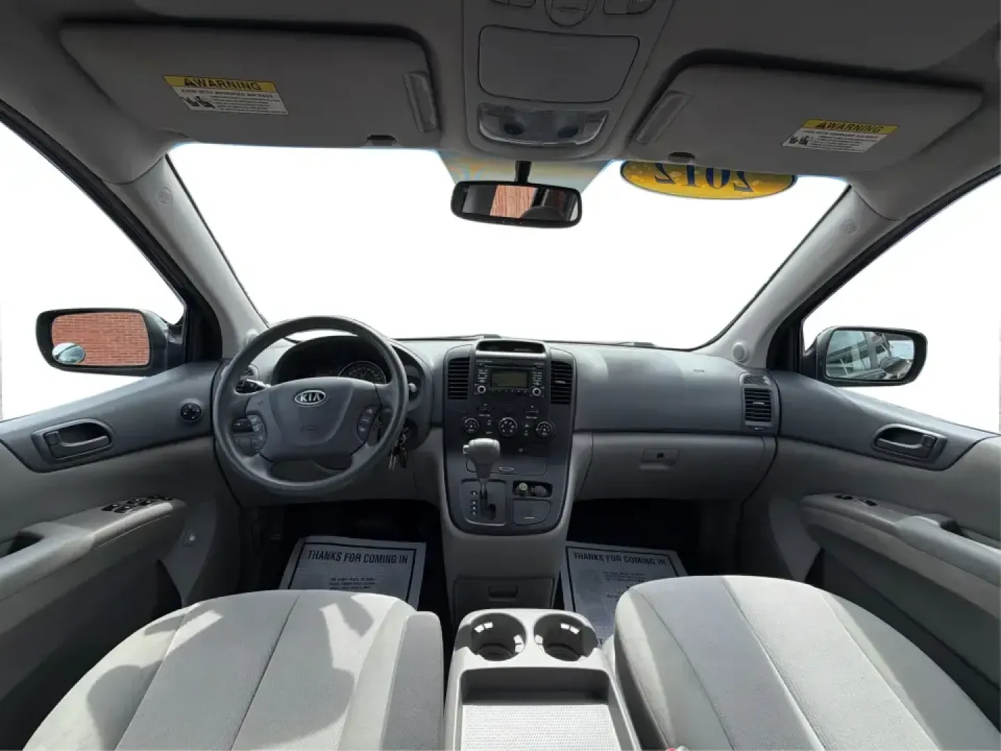 2012 Kia Sedona LX (KNDMG4C78C6) with an 3.5L V-6 DOHC engine, 5-Speed Automatic transmission, located at 1184 Kauffman Ave, Fairborn, OH, 45324, (937) 908-9800, 39.807072, -84.030914 - Picture the next family road trip, soccer Saturday, or airport pickup where everyone actually fits comfortably-plus there's room left for groceries, strollers, and weekend gear. This 2012 Kia Sedona LX in Aurora Black is built for real life: school drop-offs, long commutes across the Miami Valley, a - Photo#20