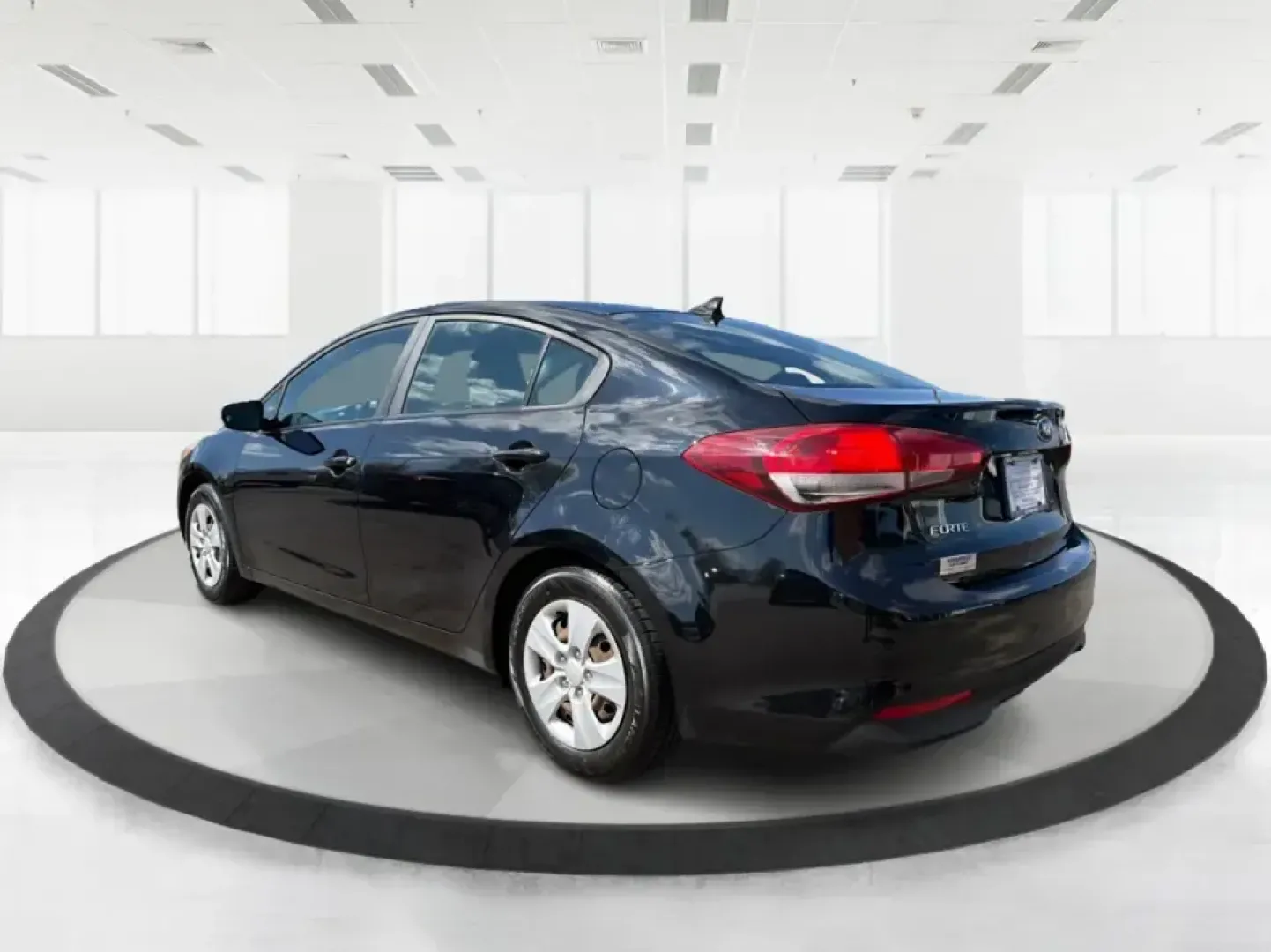 2018 Kia Forte LX (3KPFK4A79JE) with an 2L I-4 DOHC engine, 6M transmission, located at 401 Woodman Dr, Riverside, OH, 45431, (937) 908-9800, 39.760899, -84.123421 - Need a dependable commuter that's easy to park downtown, comfortable for I-75 and SR-725 traffic, and still stylish enough for dinner in the Dayton area? This 2018 Kia Forte LX in Aurora Black is a smart, budget-friendly sedan that fits real life in Moraine, OH-whether you're stacking miles for work - Photo#4