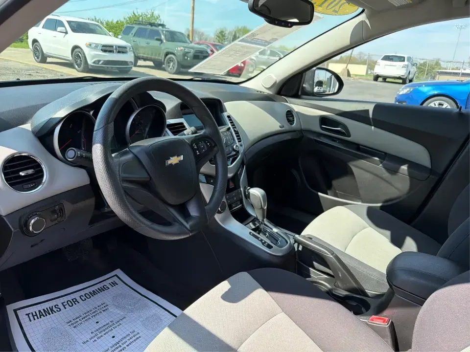 2013 Chevrolet Cruze LS Auto (1G1PA5SG2D7) with an 1.8L L4 DOHC 16V engine, 6-Speed Automatic transmission, located at 1099 N County Rd 25A, Troy, OH, 45373, (937) 908-9800, 40.057079, -84.212883 - Need a dependable commuter that sips fuel, fits five, and still feels comfortable for weekend errands and quick road trips? This **2013 Chevrolet Cruze LS Auto** is a smart pick for busy schedules in and around **Troy, Ohio**, whether you're heading down **I-75**, cruising **SR-55**, or making the d- Photo#9
