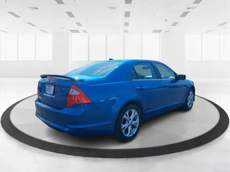 2012 Ford Fusion SE (3FAHP0HAXCR) with an 2.5L L4 DOHC 16V engine, located at 1099 N County Rd 25A, Troy, OH, 45373, (937) 908-9800, 40.057079, -84.212883 - Need a dependable sedan that makes everyday life easier-whether you're commuting down I-75 to Dayton, running errands around Troy, or planning a weekend drive past the Miami River and downtown's shops and festivals? This 2012 Ford Fusion SE in Blue Flame Metallic is a smart, comfortable choice for b - Photo#2