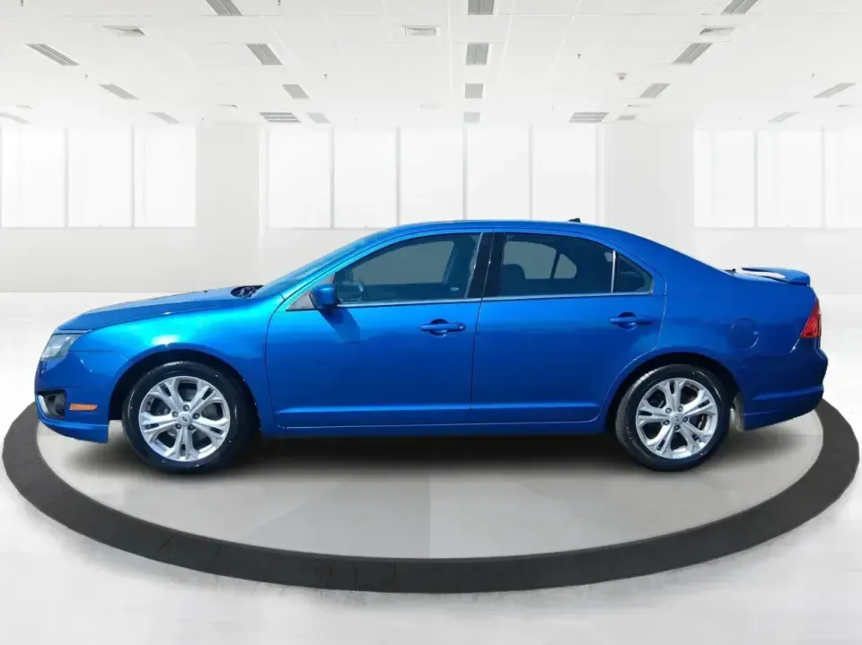 2012 Ford Fusion SE (3FAHP0HAXCR) with an 2.5L L4 DOHC 16V engine, located at 1099 N County Rd 25A, Troy, OH, 45373, (937) 908-9800, 40.057079, -84.212883 - Need a dependable sedan that makes everyday life easier-whether you're commuting down I-75 to Dayton, running errands around Troy, or planning a weekend drive past the Miami River and downtown's shops and festivals? This 2012 Ford Fusion SE in Blue Flame Metallic is a smart, comfortable choice for b - Photo#5
